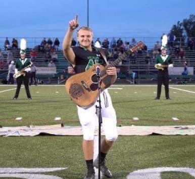 No one was willing to sing the national anthem, so one high schooler took off his helmet and grabbed a guitar